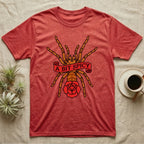 Tarantula A Bit Spicy T-Shirt in Heather Red — Tattoo-flash orange-baboon-tarantula in threat-pose with banner-scroll "A Bit Spicy" and a flash rose beneath.
