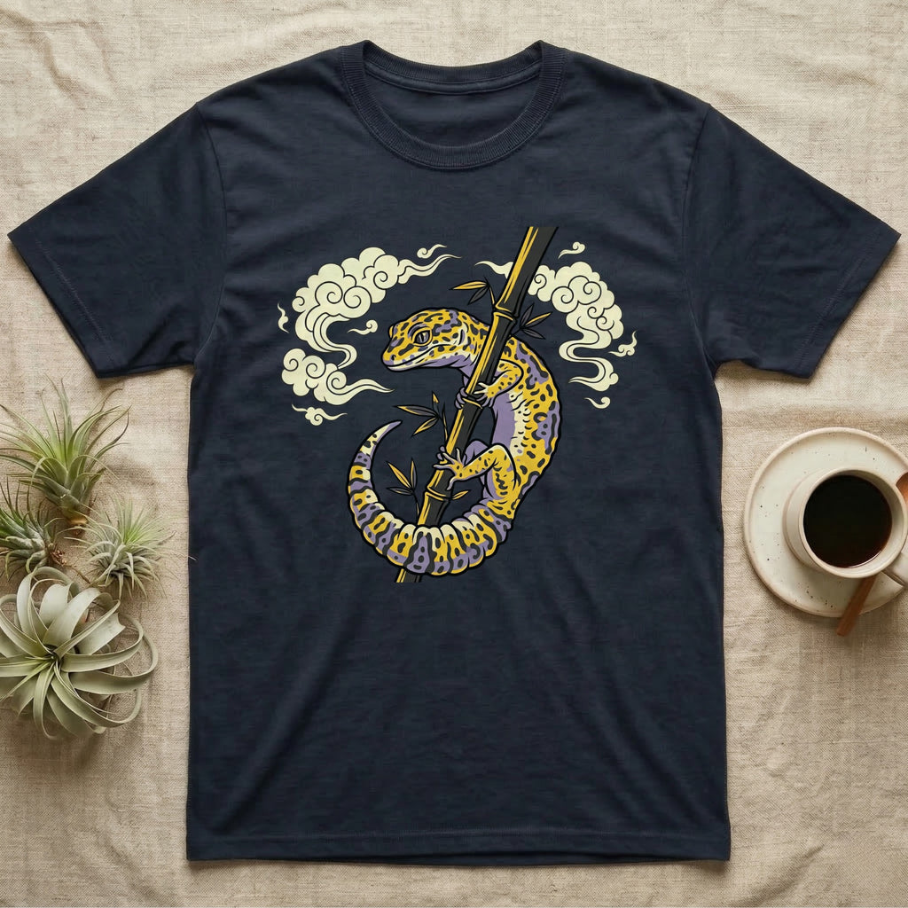 Dark t-shirt with illustration of a gecko climbing a bamboo stalk.