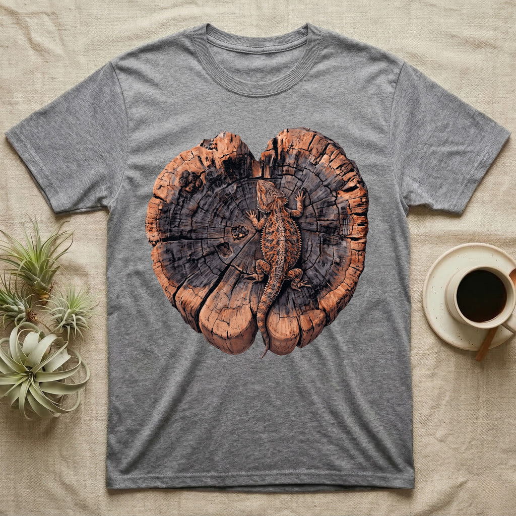 Bearded Dragon Basking Rings T-Shirt in Sport Grey — Top-down illustration of a bearded dragon splayed flat on a cross-section log slab of terracotta growth rings with bracket fungus, no on-shirt text.