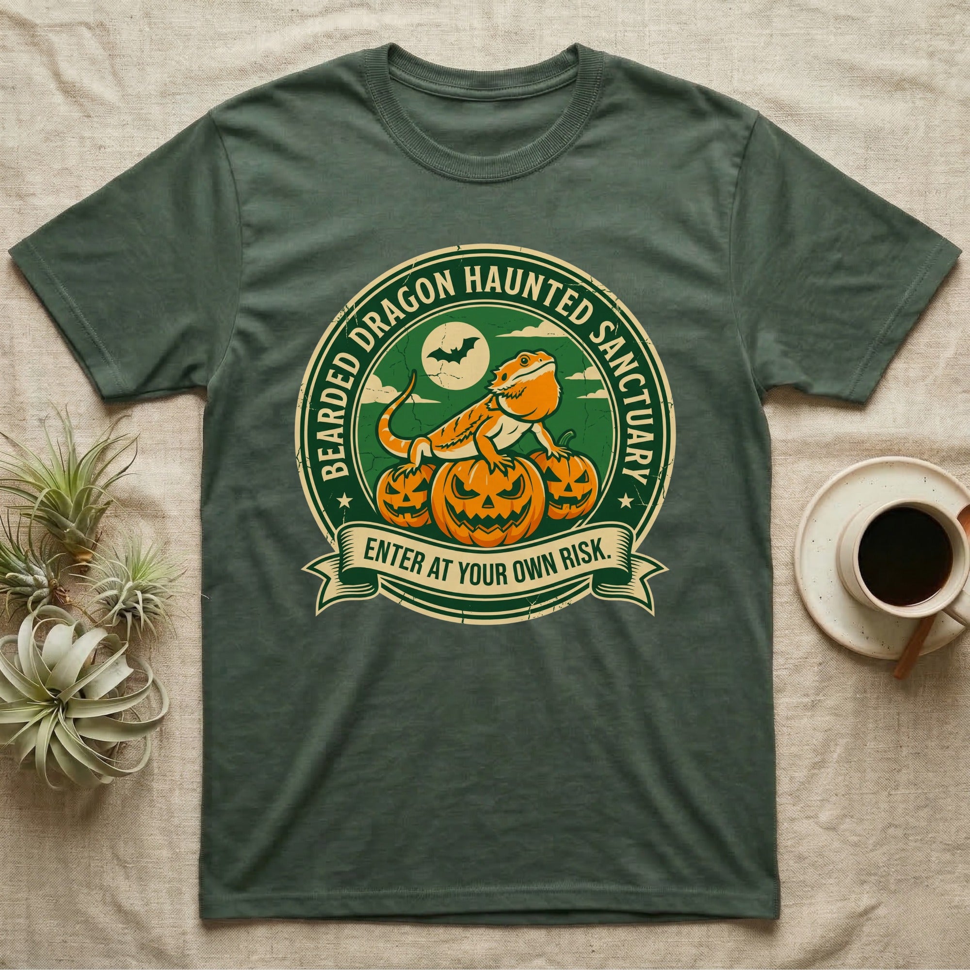 Bearded Dragon Haunted Sanctuary T-Shirt in Military Green — Vintage badge of a bearded dragon on glowing pumpkins under a moon, "Bearded Dragon Haunted Sanctuary."