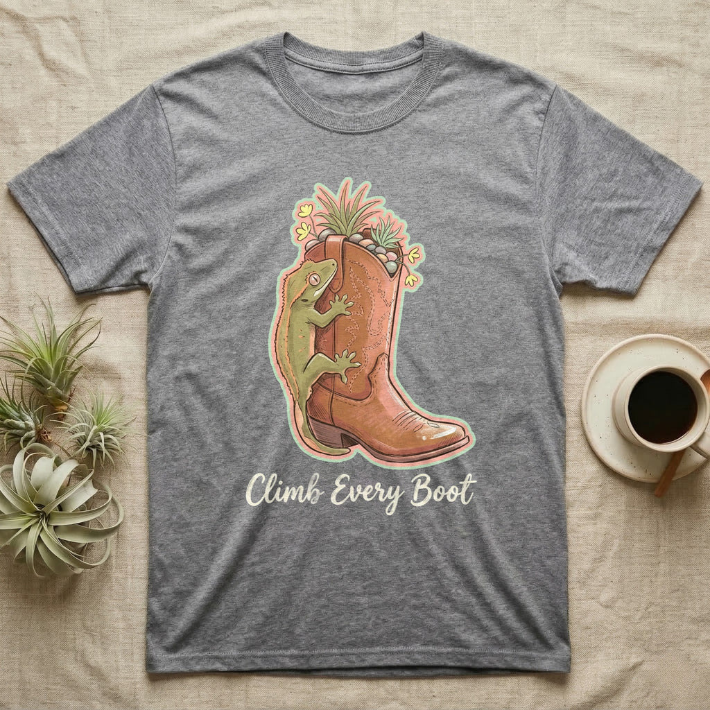 Grey t-shirt with a lizard on a cowboy boot and the text "Climb Every Boot".