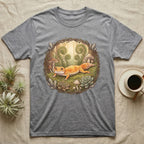 Gray t-shirt with a print of a gecko surrounded by ferns and mushrooms.