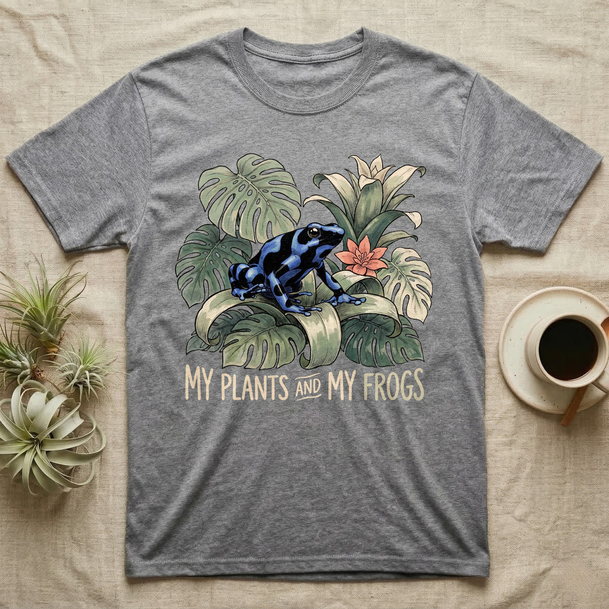 Plants And Frogs T-Shirt in Sport Grey — Naturalist-plate illustration of a dart frog perched in lush foliage with hand-lettered text reading My Plants And My Frogs.