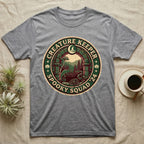 Creature Keeper Spooky Squad T-Shirt in Sport Grey — Embroidered-patch badge with a gecko, chameleon, snake and tarantula in a stone archway, "Creature Keeper Spooky Squad."