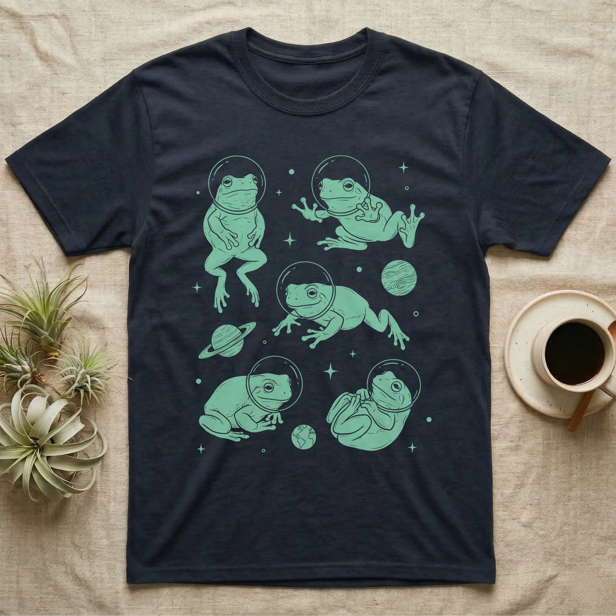 Whites Tree Frog Cosmic T-Shirt in Navy — Vintage screen-print illustration of White's tree frogs in astronaut helmets floating in space, cosmic jade green monochromatic on dark background.