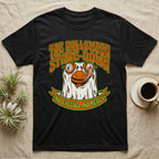 Crested Gecko Halloween Stare-Down T-Shirt in Black — Retro-horror crested gecko in a ghost sheet licking its eye, "The Halloween Stare-Down, No Eyelids No Mercy."