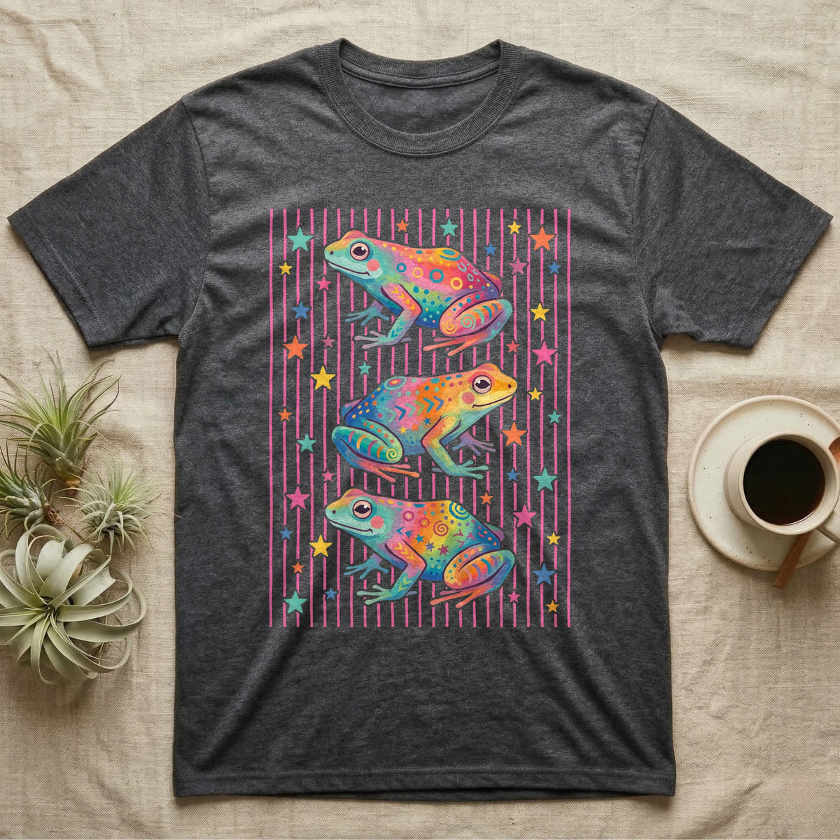 Dart Frog Disco Stripes T-Shirt in Dark Heather — Three rainbow poison dart frog morphs stacked on a pink-and-cream candy-stripe field with scattered stars.