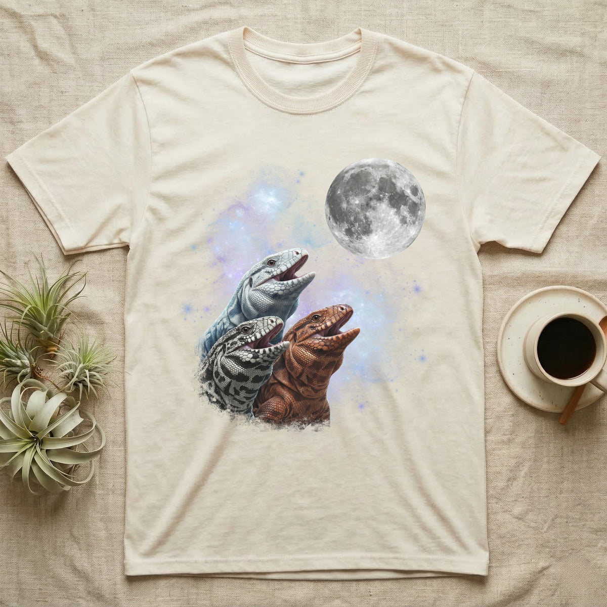 Tegu Moon Howl T-Shirt in Natural — Three Tegu colour morphs howling at a full moon over a nebula on a dark grey t-shirt.