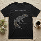 Leopard Gecko Anatomy T-Shirt in Black — One-ink leopard gecko specimen with "Know Your Gecko" header and handwritten labels for eyelids, tail, toes.