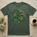 Green t-shirt with a coiled black and green snake and floral design.