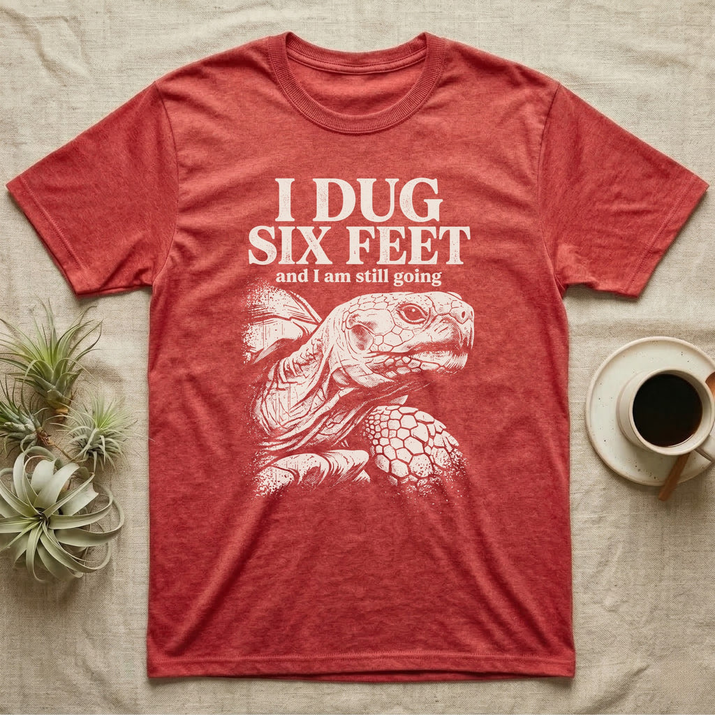 Sulcata Tortoise Dug Six Feet T-Shirt in Heather Red — One-ink white sulcata tortoise portrait on black under the words I DUG SIX FEET and I am still going.