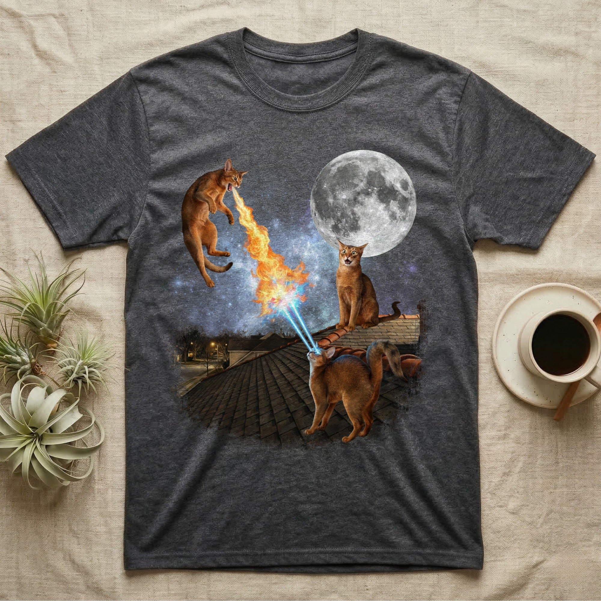 T-shirt with cats on a roof shooting lasers and fire at a moon.