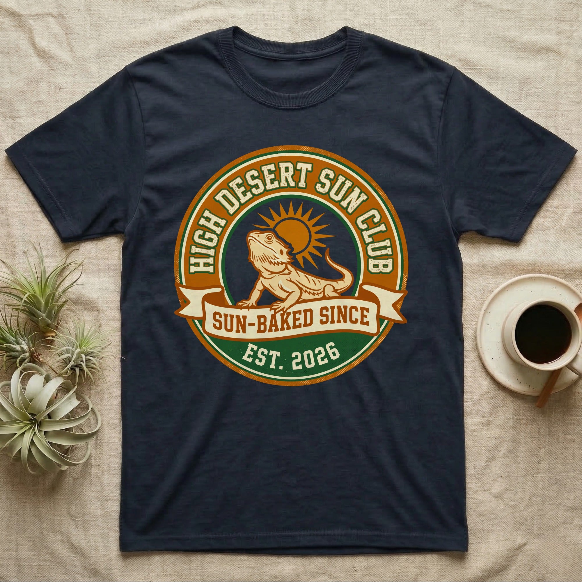 Navy t-shirt with "High Desert Sun Club" emblem, bearded dragon, sun, and "Est. 2026".