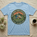 Light blue t-shirt with "Blue Tongue Skink Adventure Co." graphic and a lizard.