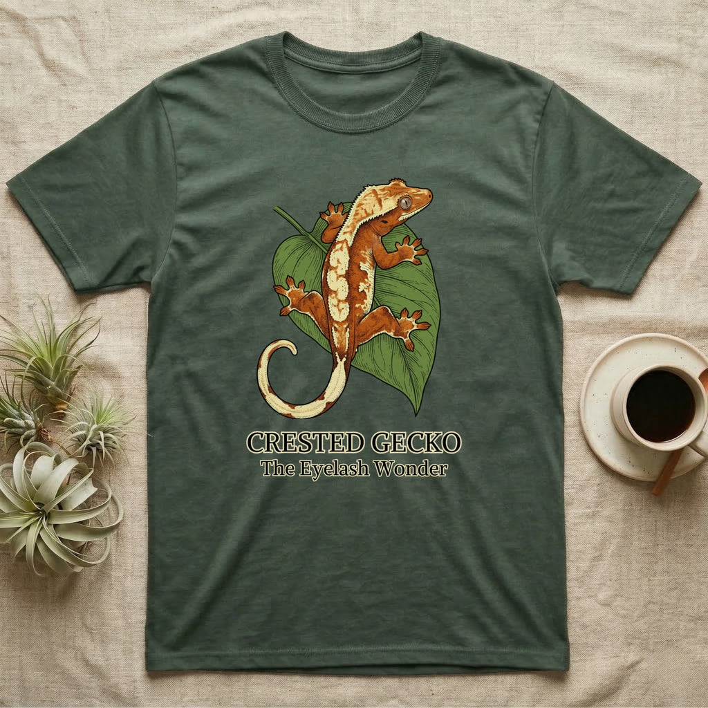 Green t-shirt with crested gecko on a leaf, text "CRESTED GECKO The Eyelash Wonder."