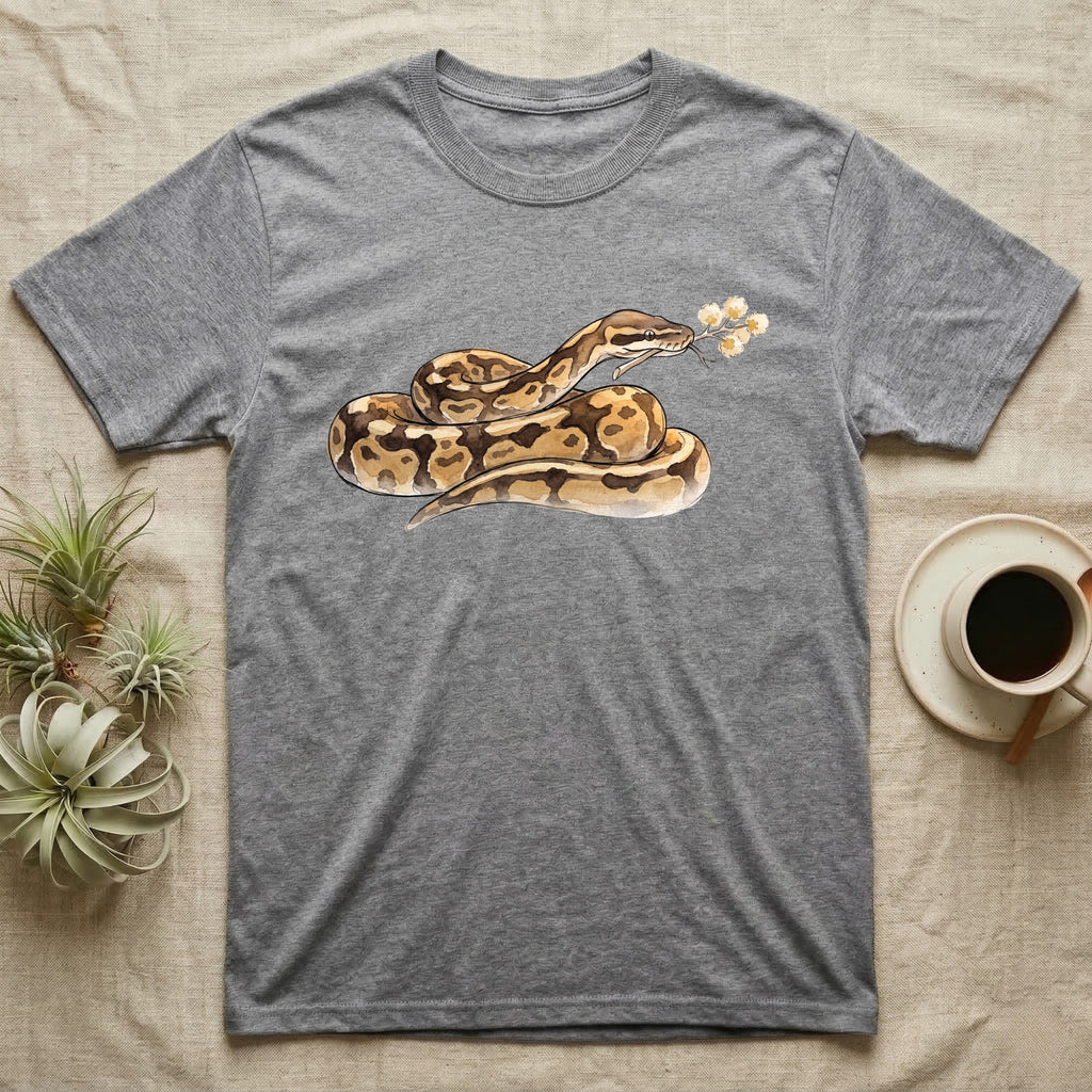 Ball Python Blossom T-Shirt in Sport Grey — Watercolor illustration of a tan-and-brown ball python holding an acacia blossom sprig, on a dark grey t-shirt.