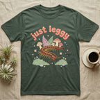 Vietnamese Centipede Baby T-Shirt in Military Green — Many-legged Vietnamese centipede curving among pastel ferns and toadstools under puffy coral text "just leggy".