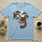 Light blue t-shirt with a red panda hanging from a tree branch under the moon.