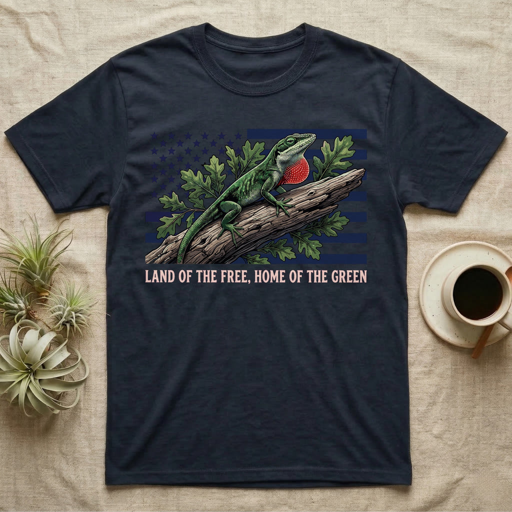 Green Anole 1776 T-Shirt in Navy — Realistic green anole with a red dewlap on a branch over a distressed flag under text Land of the Free, Home of the Green.
