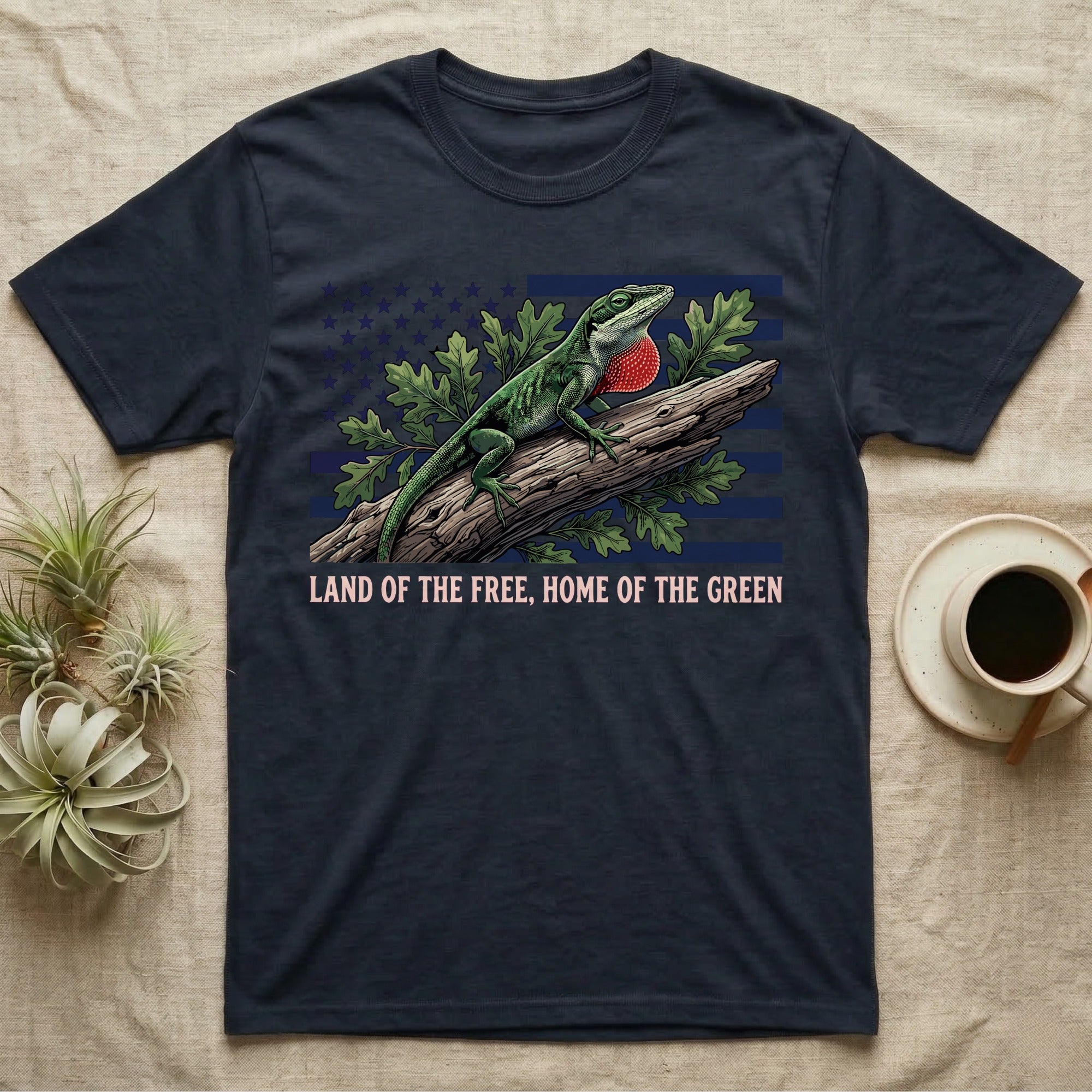 Green Anole 1776 T-Shirt in Navy — Realistic green anole with a red dewlap on a branch over a distressed flag under text Land of the Free, Home of the Green.