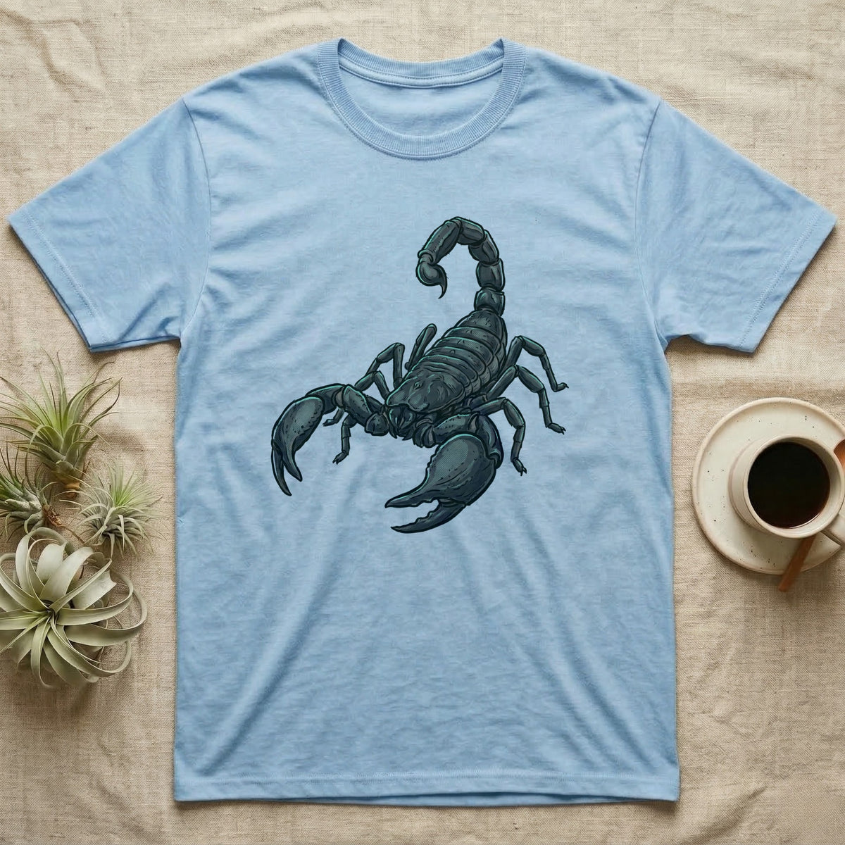 Glowing Emperor Scorpion T-Shirt in Light Blue — Bold flat illustration of an emperor scorpion traced with a glowing blacklight-teal UV rim on a grey background.