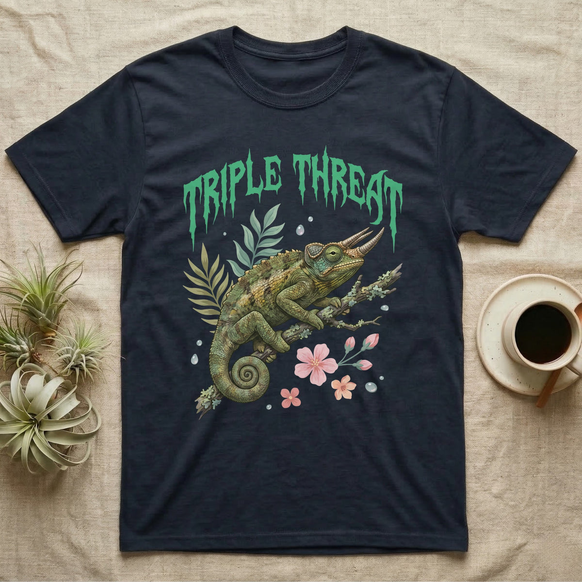 Jackson's Chameleon Feral T-Shirt in Navy — Three-horned Jackson's chameleon on a branch below a dripping jade-green metal "Triple Threat" wordmark