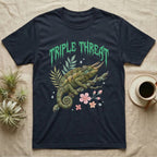 Jackson's Chameleon Feral T-Shirt in Navy — Three-horned Jackson's chameleon on a branch below a dripping jade-green metal "Triple Threat" wordmark