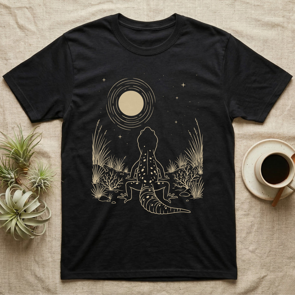 Leopard Gecko Moon T-Shirt in Black — Scratchboard illustration of a leopard gecko seen from behind, looking up at a scratched moon over dry grasses.