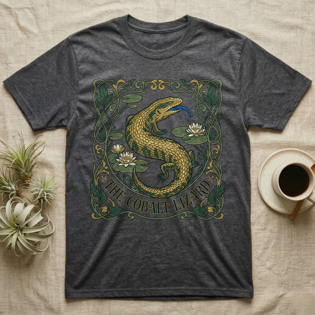 Dark grey t-shirt featuring a green and gold lizard with blue tongue surrounded by art nouveau floral details.