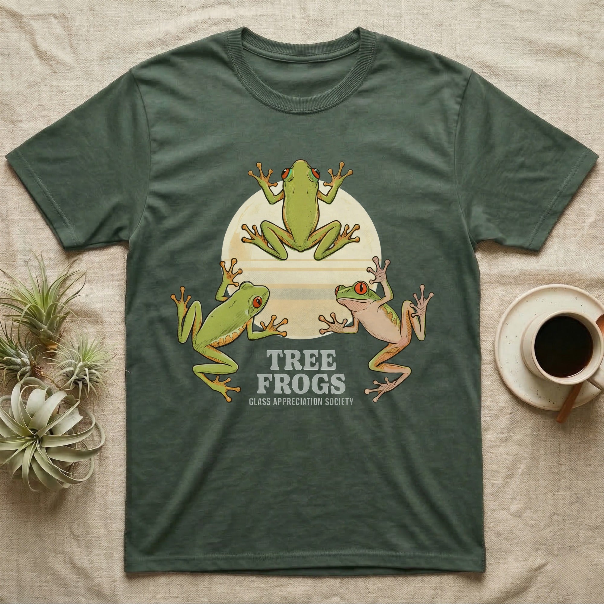 Three Tree Frog Moon T-Shirt in Military Green — Retro-illustration of three tree frogs in splayed glass-cling poses around a stratified halftone full moon.