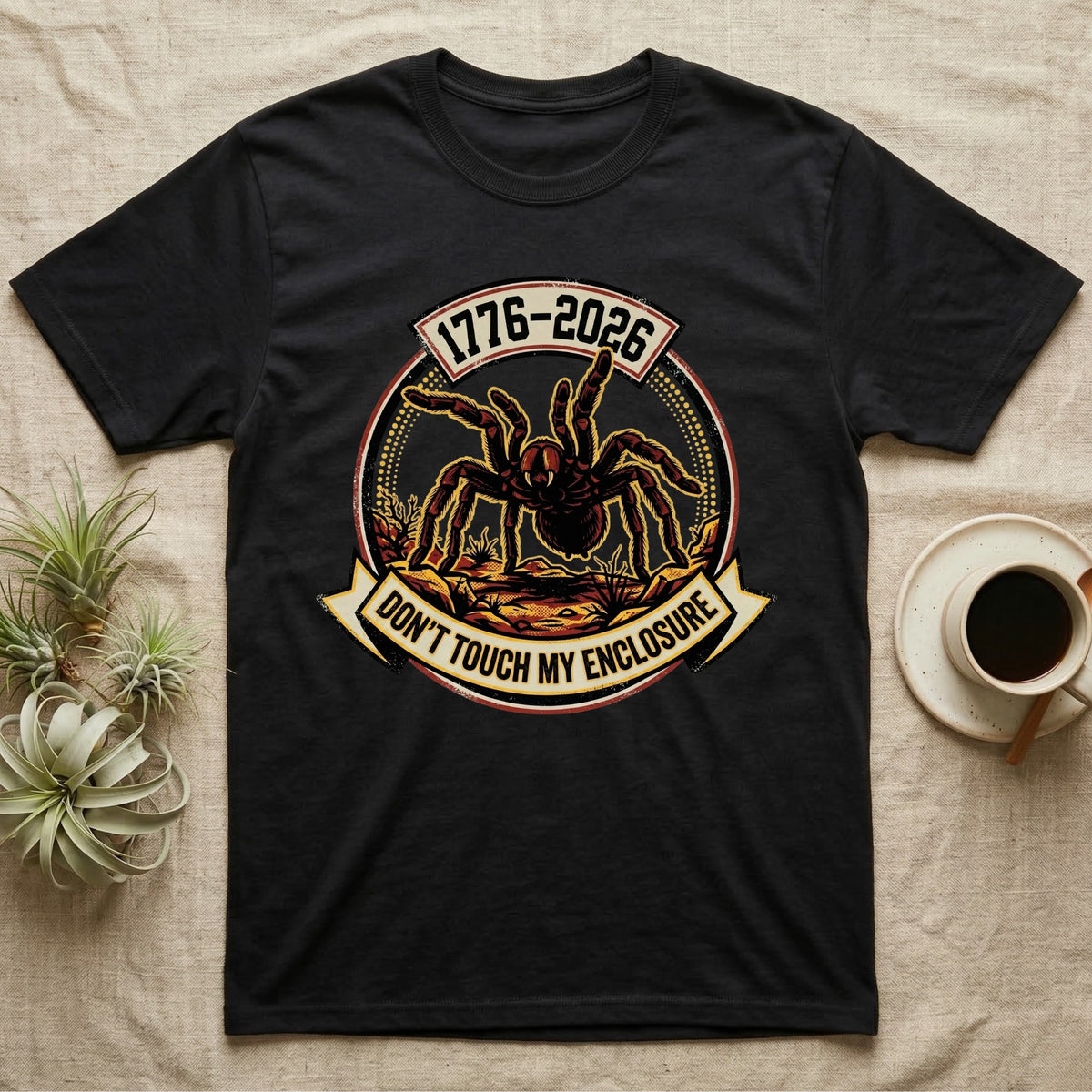 Tarantula Don't Touch Enclosure Tee in Black — Distressed circular badge of a defensive tarantula on desert ground, red and gold banner reading Don't Touch My Enclosure, on black.