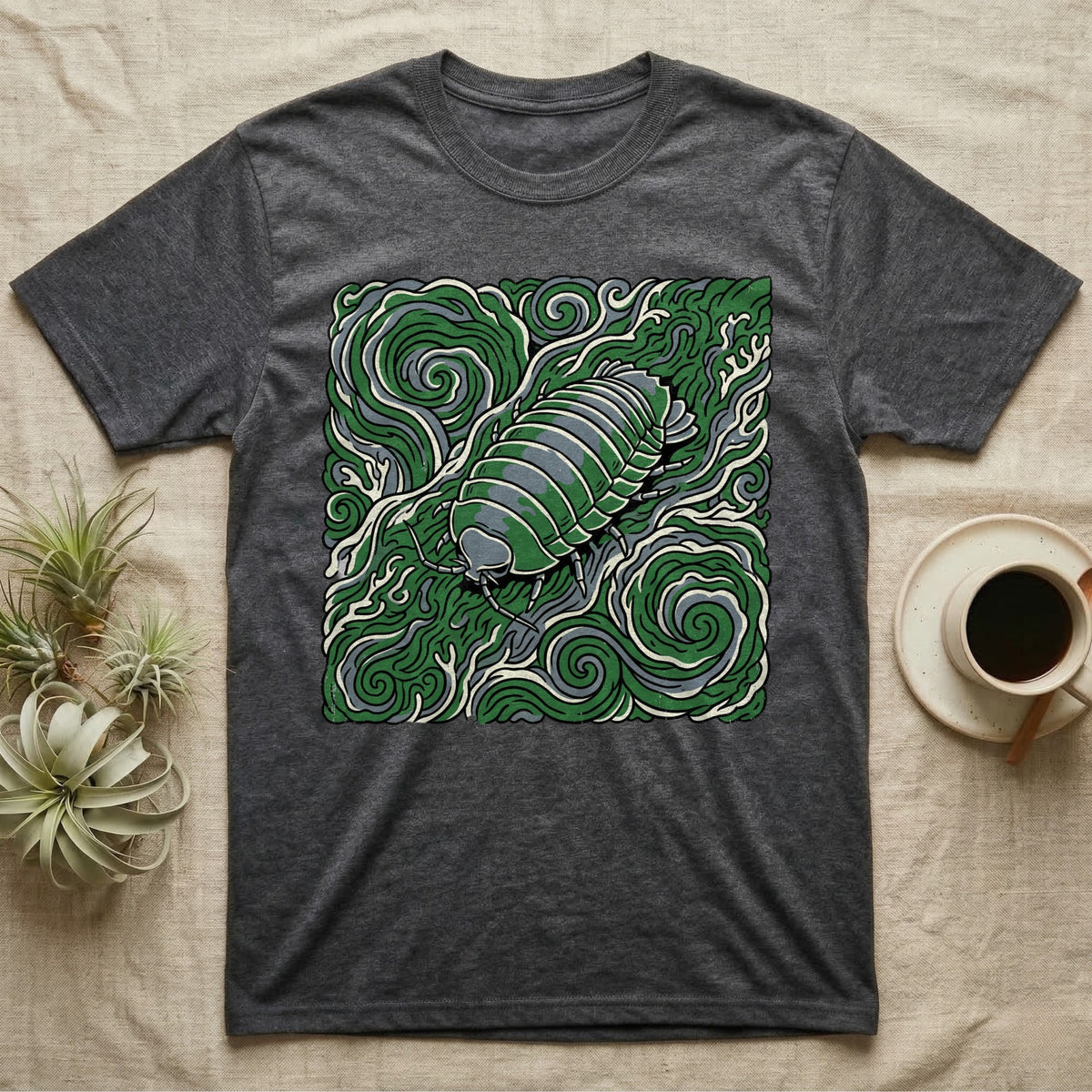 Dark gray t-shirt featuring a green isopod illustration with swirling organic patterns.