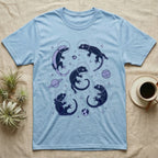 Crested Gecko Cosmic T-Shirt in Light Blue — Vintage screen-print illustration of crested geckos in astronaut helmets floating in space, deep cosmic indigo monochromatic on dark background.