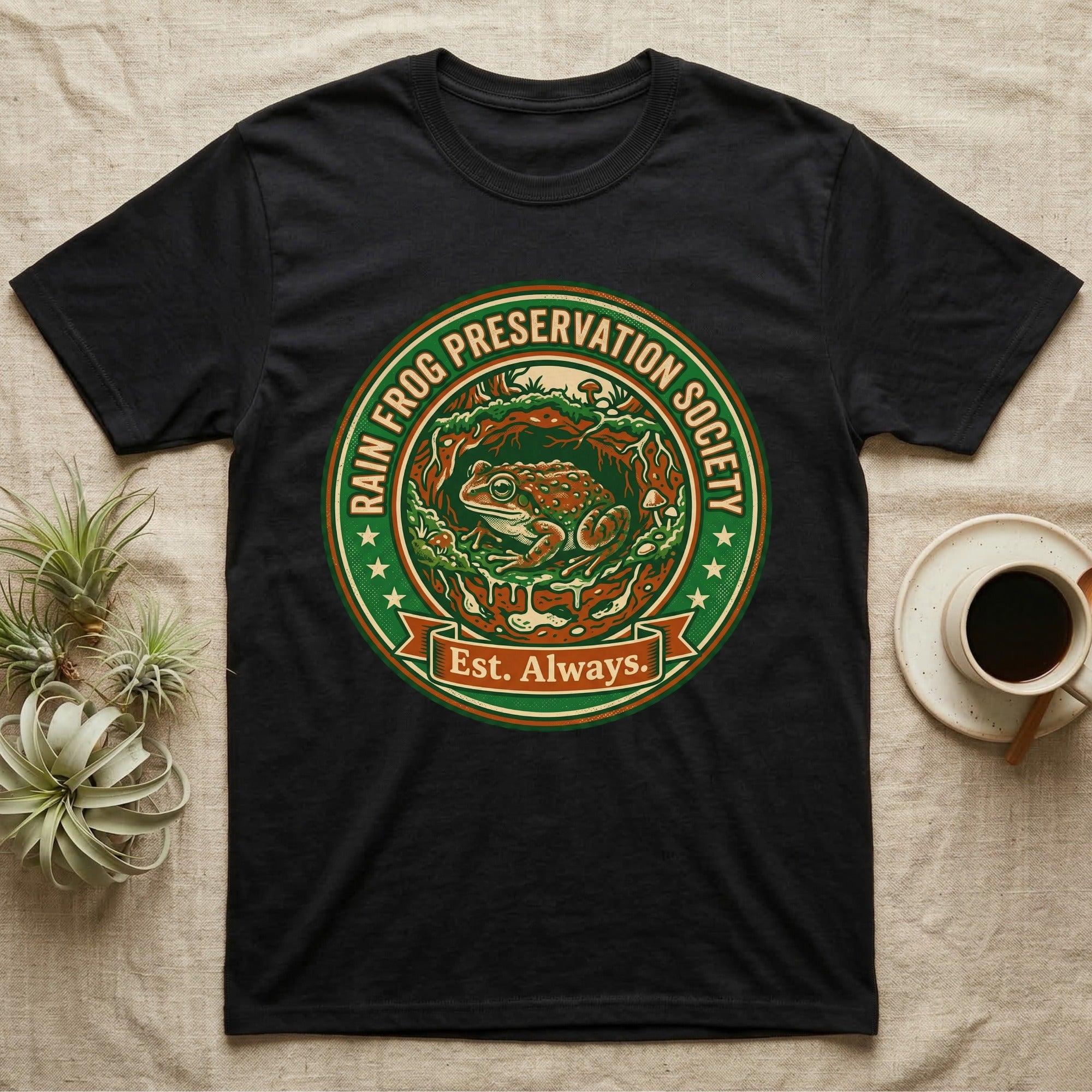 Black t-shirt with circular logo: "Rain Frog Preservation Society Est. Always."