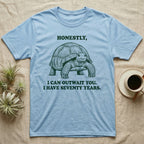 Sulcata Tortoise The Fence Lost T-Shirt in Light Blue — Block-print sulcata tortoise mid-stride in one terracotta ink, ringed by the words THE FENCE LOST and it was in my way.