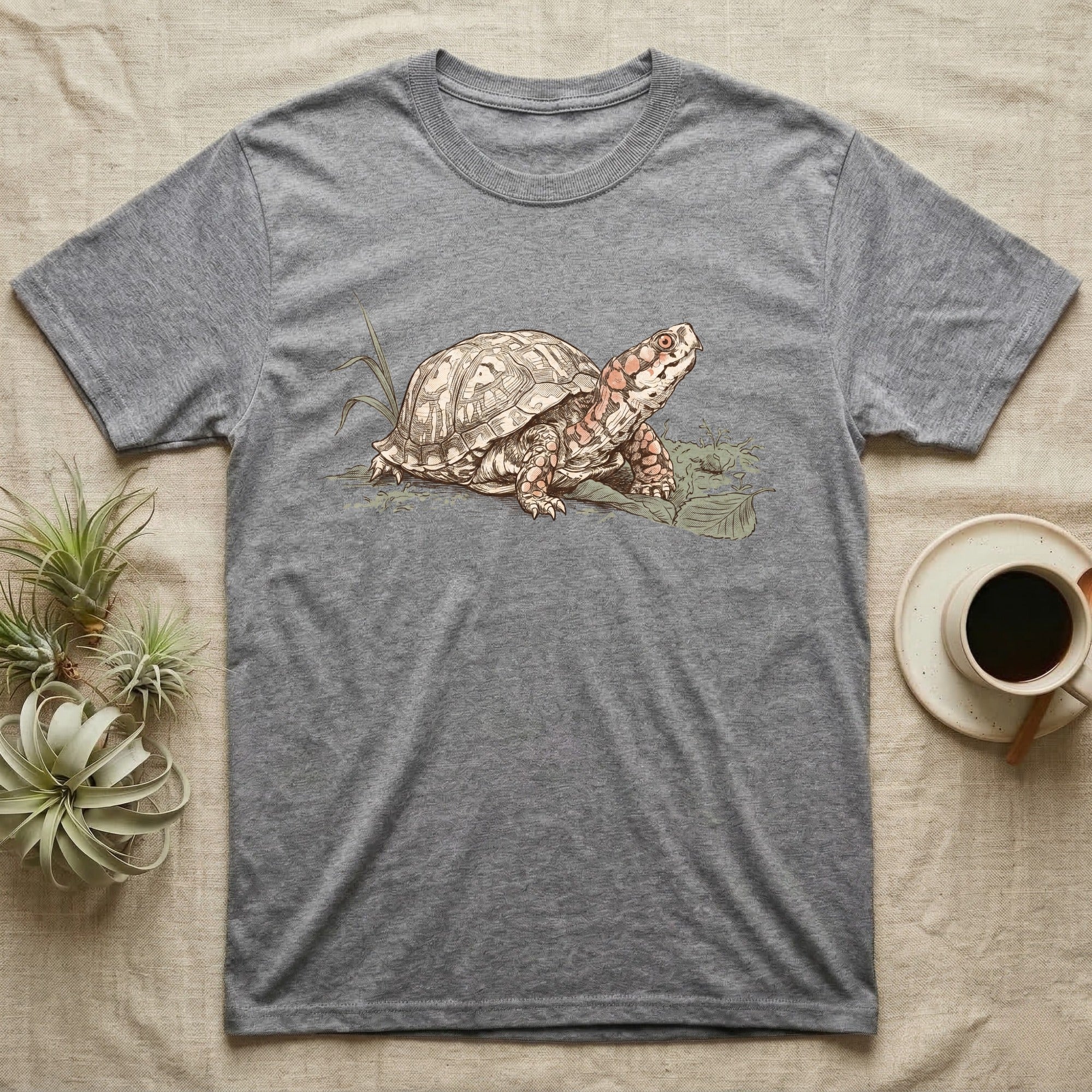 Box Turtle Shell T-Shirt in Sport Grey — Naturalist-plate illustration of a box turtle with its shell shown as living body, above a serif welfare creed caption.