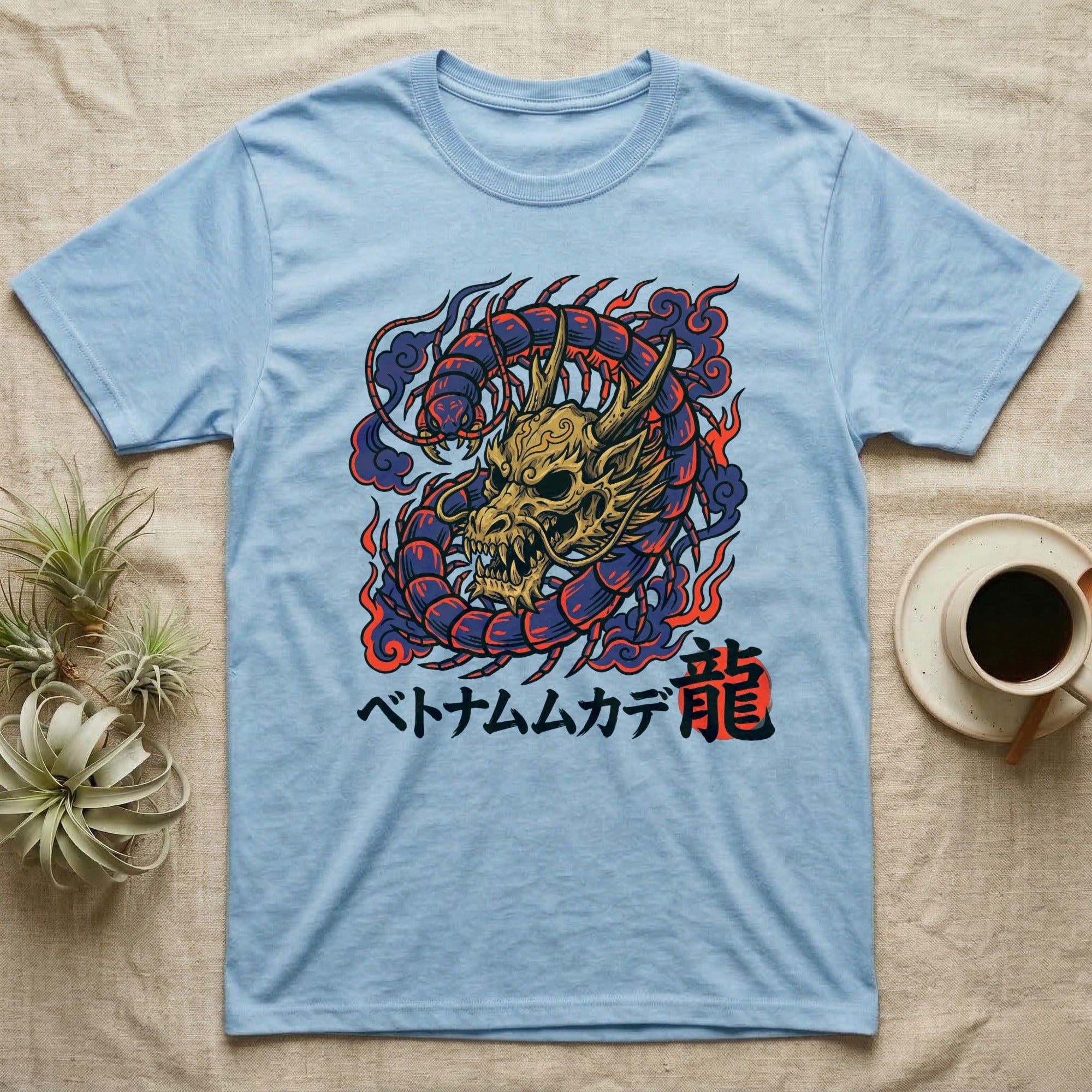 Light blue t-shirt with a golden dragon and Japanese text.