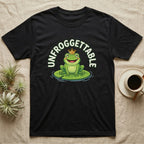 Black t-shirt with a smiling frog wearing a crown on a lily pad.