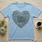 Light blue t-shirt with a heart-shaped floral design featuring a Scottish Fold cat.