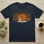 Navy t-shirt with sleeping red fox and forest flora illustration.