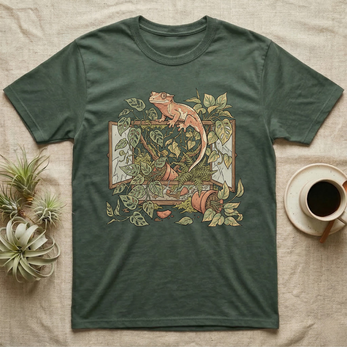 Bioactive Crested Gecko T-Shirt in Military Green — Botanical illustration of a smug crested gecko perched atop a lush overgrown planted vivarium spilling vines.