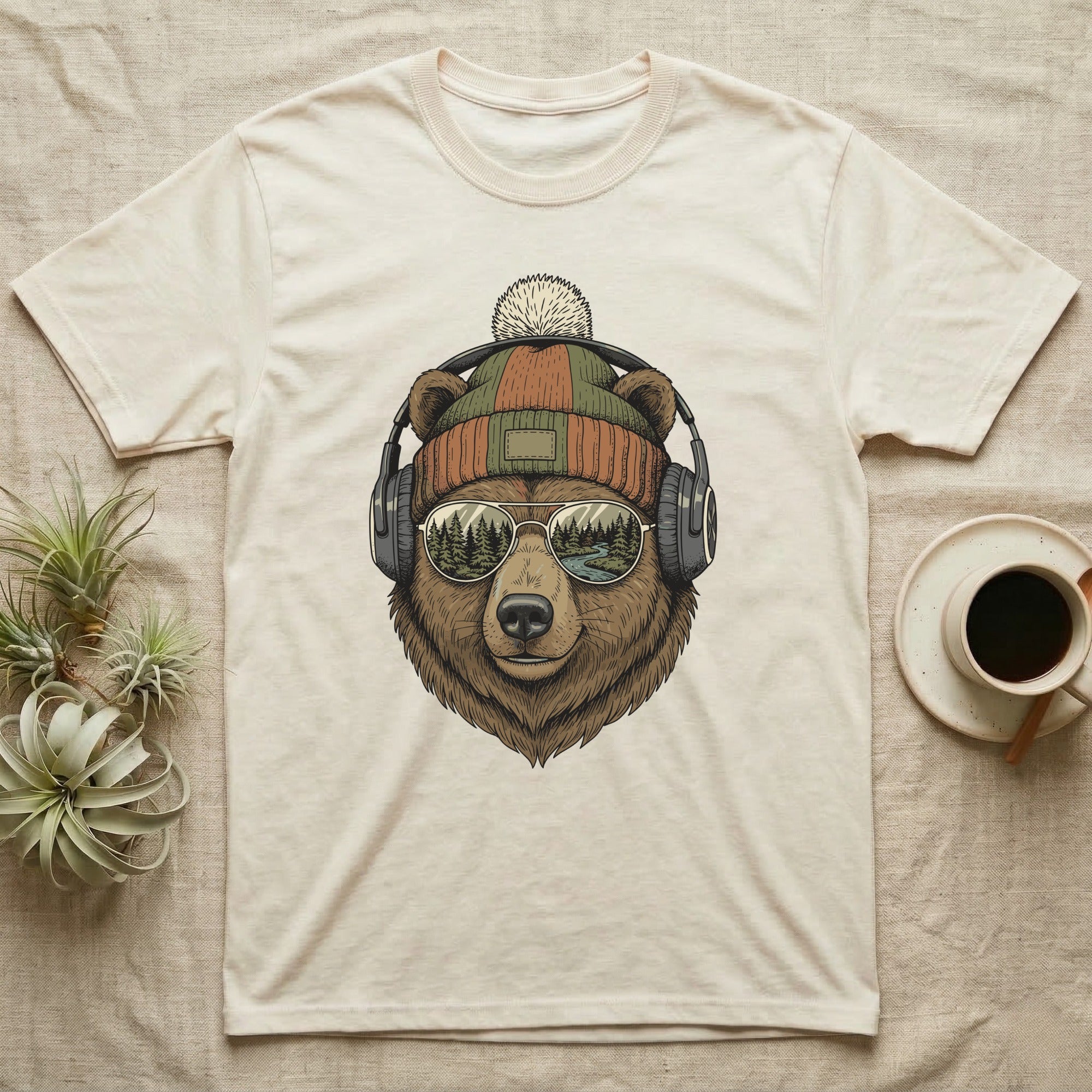 Bear wearing beanie and headphones, mirrored sunglasses reflect a forest.