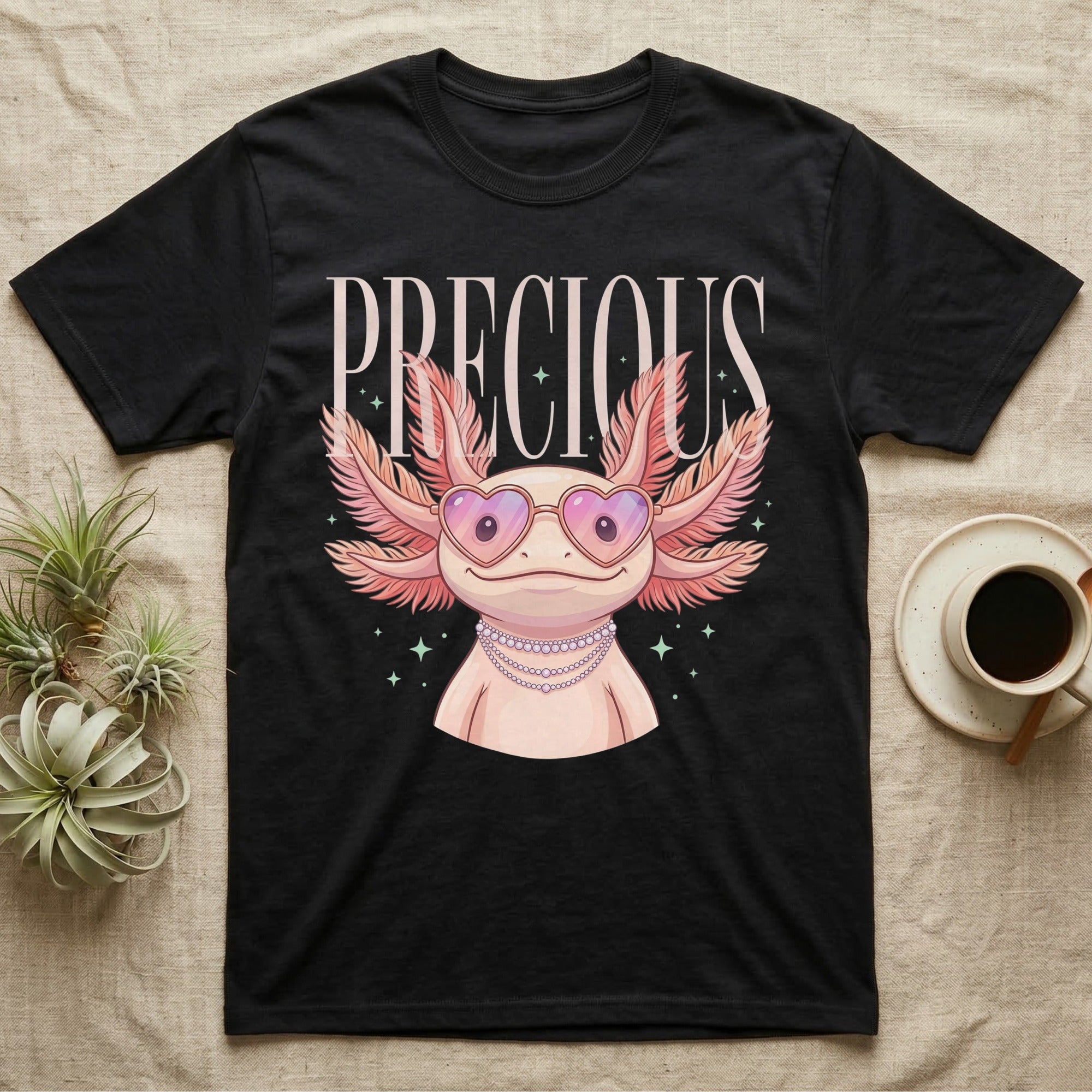 Black t-shirt with a pink axolotl wearing heart sunglasses and a pearl necklace.
