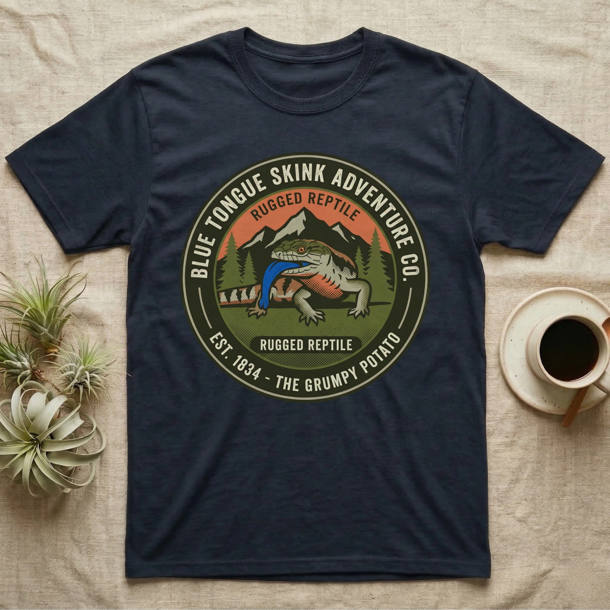 Dark blue t-shirt with "Blue Tongue Skink Adventure" and a lizard graphic.