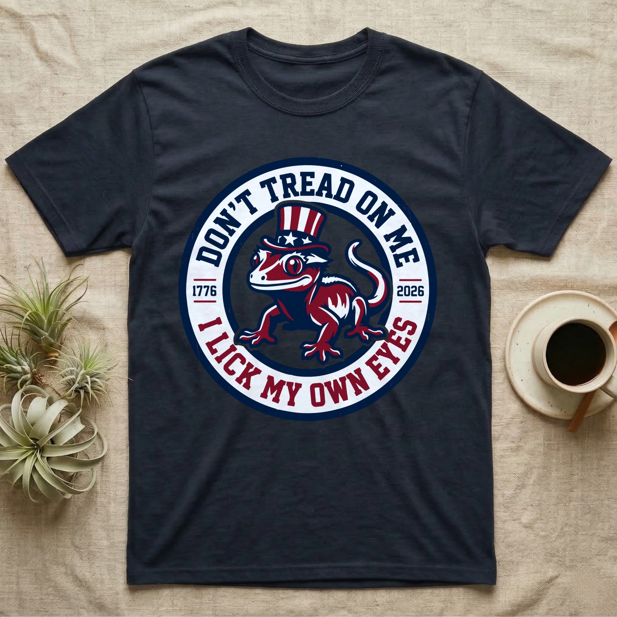 Crested Gecko 1776 T-Shirt in Navy — Distressed crest of a crested gecko in a top hat with text Don't Tread On Me and I Lick My Own Eyes.