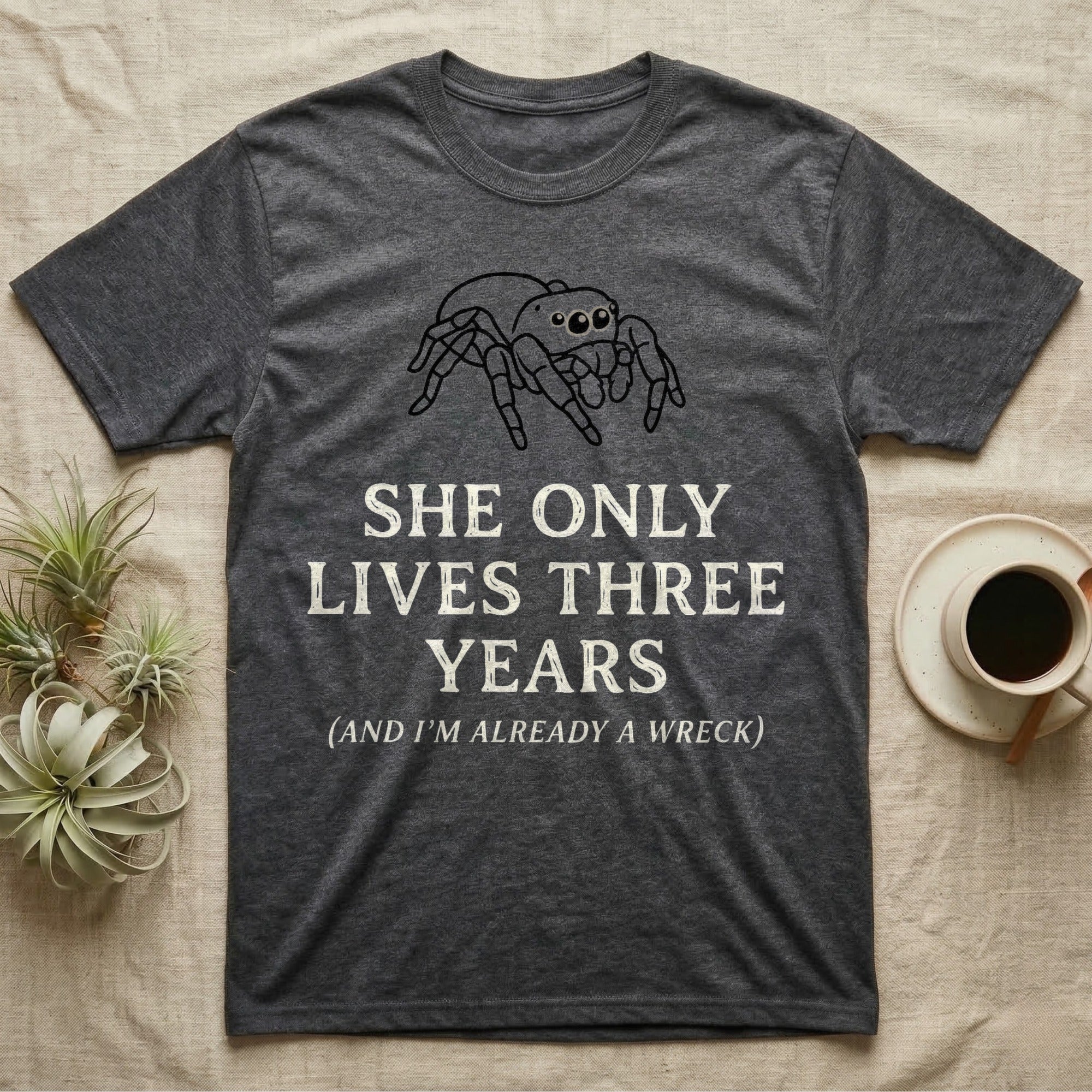Jumping Spider Three Years Tee in Dark Heather — Vintage-ink Phidippus jumping spider portrait above type "She Only Lives Three Years (And I'm Already A Wreck)."
