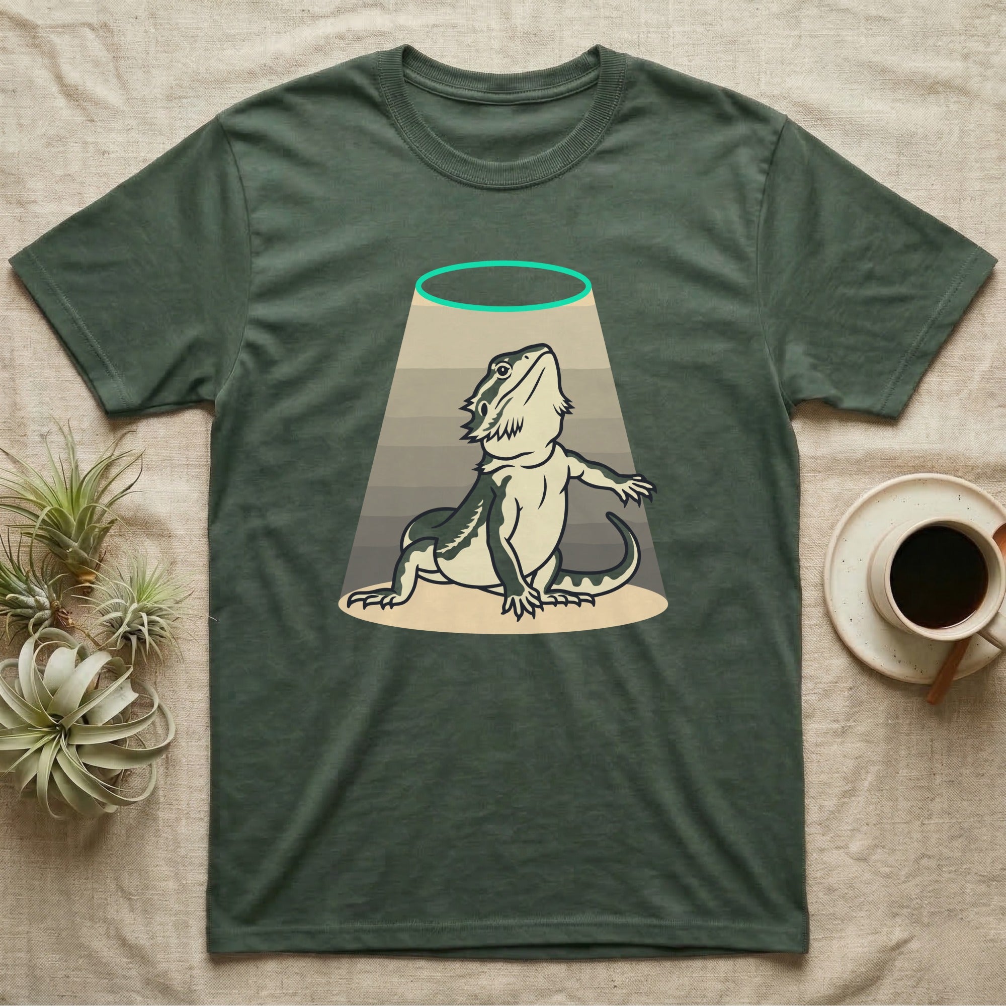 Bearded Dragon Diva T-Shirt in Military Green — Bold vector illustration of a bearded dragon in a dramatic stage pose under a soft spotlight, chin lifted.