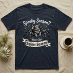 Jumping Spider Viking Helmet T-Shirt in Navy — Ink-sketch jumping spider in a Viking helmet over a web, banner reading "More Like Spider Season."