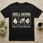 Hermit Crab Shell Dating T-Shirt in Black — Vintage-ink hermit crab leaning toward a pristine shell, chipped shell on the right, carved type "Shell Dating. Swipe Left."