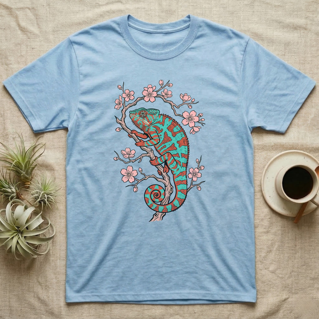 Blue t-shirt with a teal and orange chameleon on a cherry blossom branch.